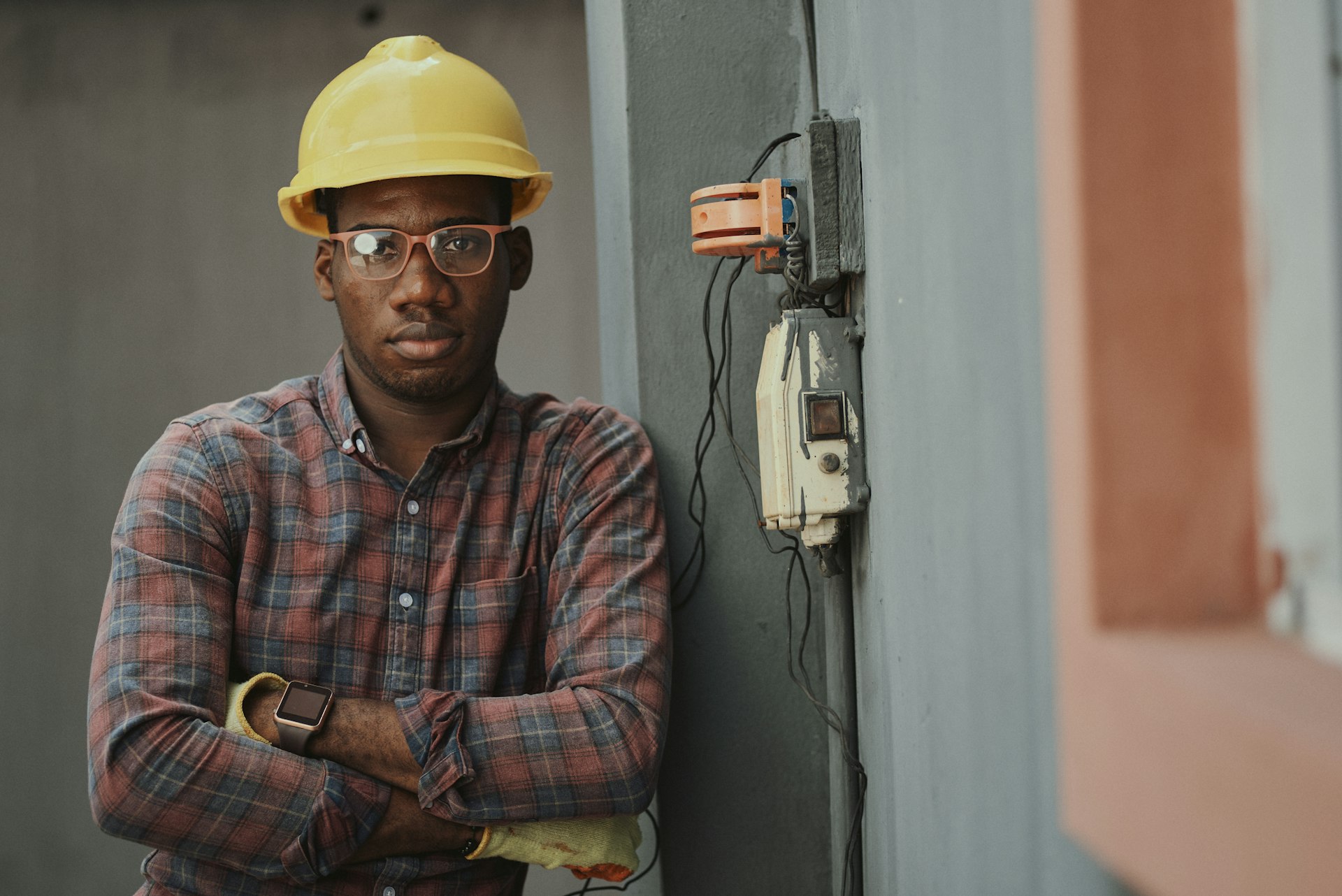 Licensed Beacon Electric Co. technician beside a residential panel